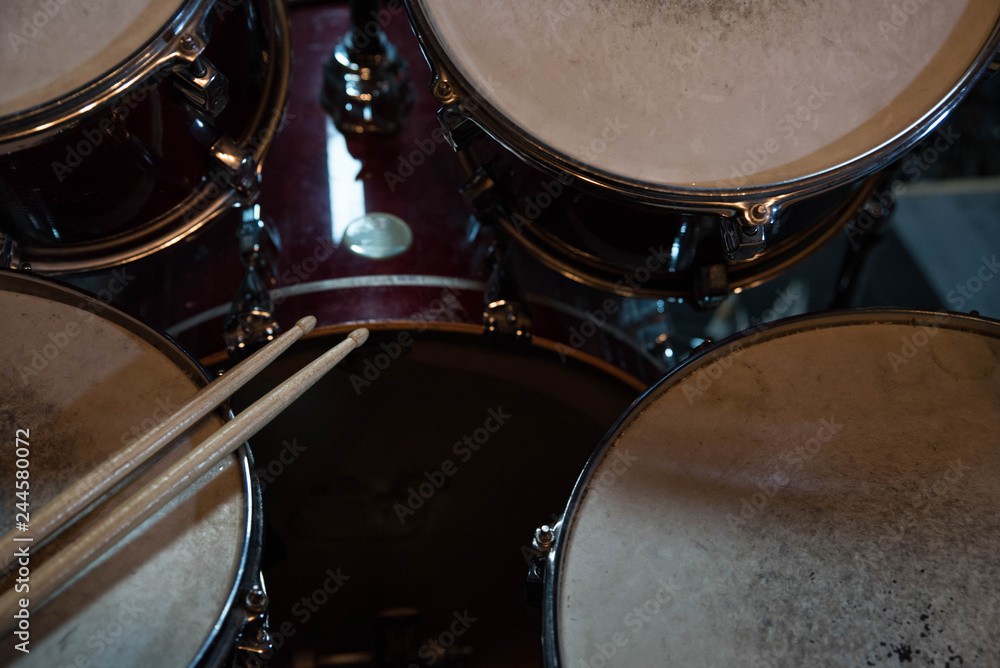 Professional drum set closeup. Drummer with drumsticks playing drums and cymbals, on the live music rock concert or in recording studio Professional drum set closeup. Drummer with drumsticks playing drums and cymbals, on the live music rock concert or in recording studio