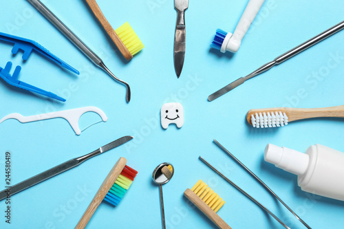 Flat lay composition with items for mouth and teeth care on color background