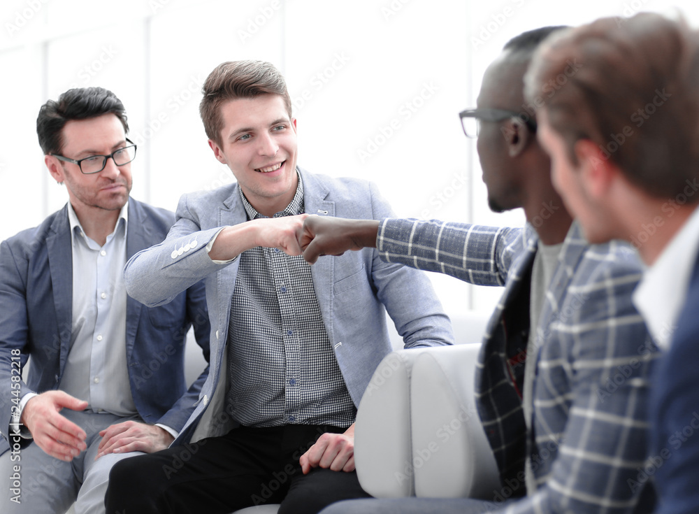 business colleagues using fists as a symbol of companionship business colleagues using fists as a symbol of companionship