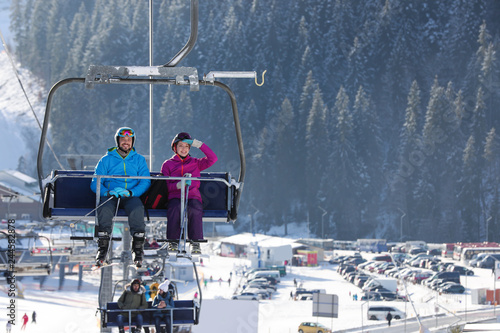 Slika na platnu People using chairlift at mountain ski resort. Winter vacation