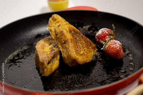 Traditional French toast in a pan