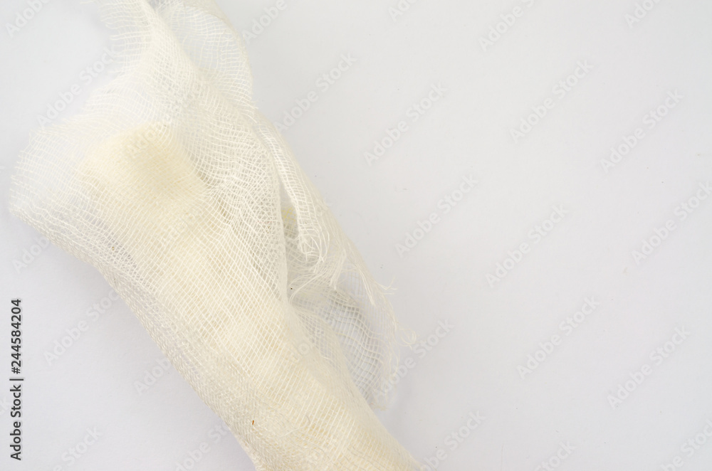 Medical glove and bandage on a white background. Medical glove and bandage on a white background.