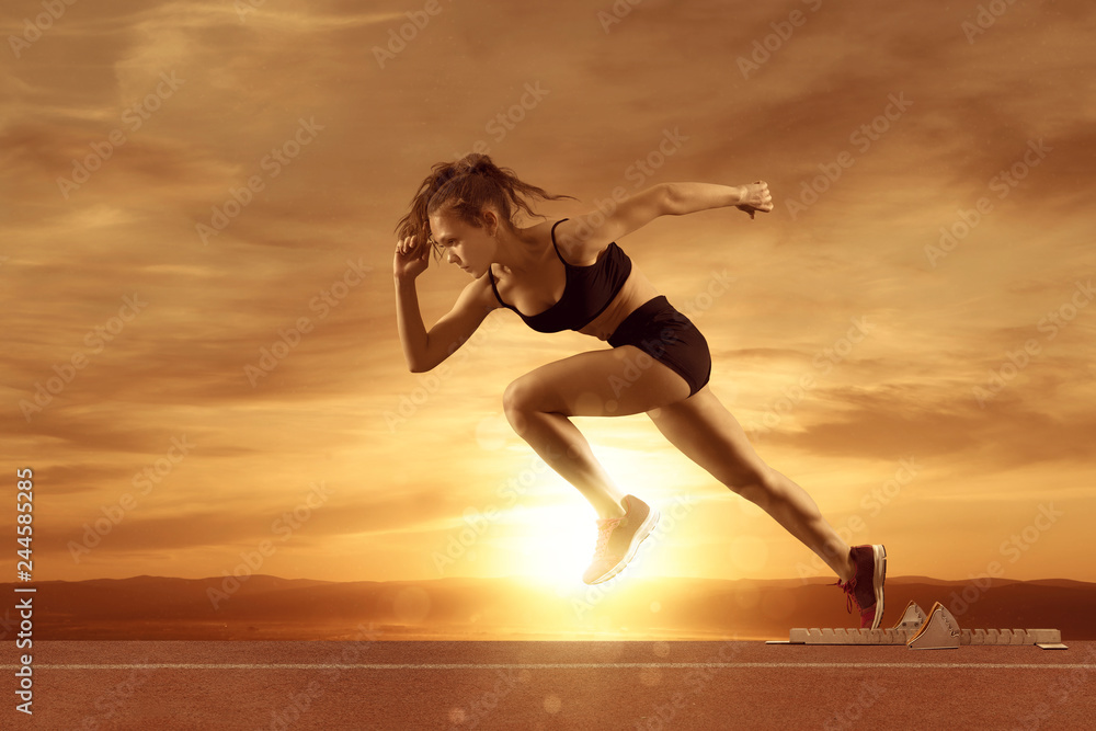 Fototapeta premium Woman sprinter leaving starting