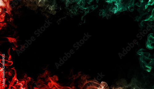 Red vs Green colorful smoke at the edges frame. Effect for film , text or space