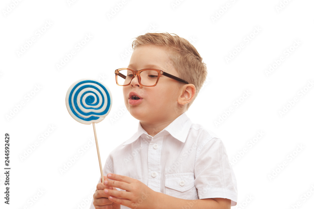Little boy wants to eat his beautiful lollipop Little boy wants to eat his beautiful lollipop