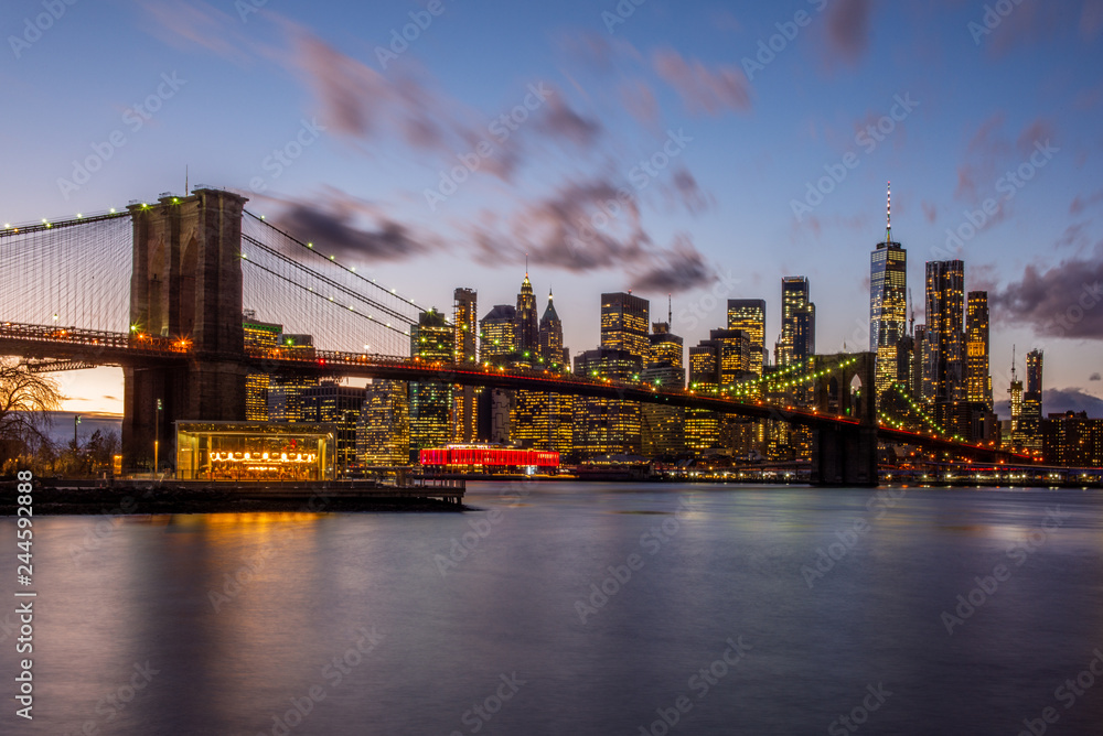 View of the Brooklyn Bridge and Manhattan from the riverside of the East River at sunset - 3