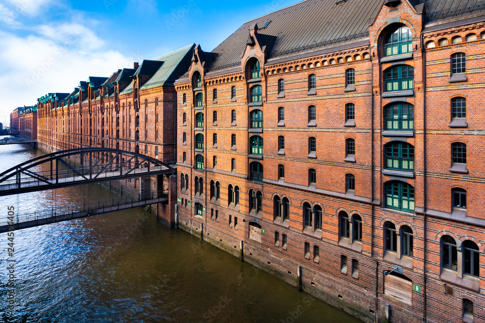 The Warehouse District (German: Speicherstadt) in Hamburg, Germany. The largest warehouse district in the world is located in the port of Hamburg within the HafenCity quarter.