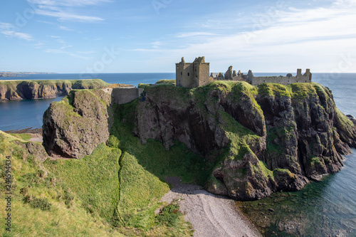 Dunnottar Castle is a ruined medieval fortress located upon a rocky headland on the northeastern coast of Scotland