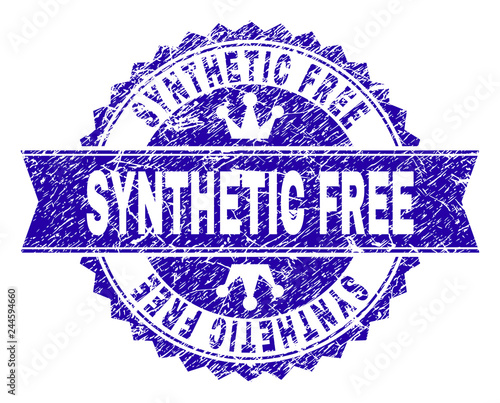 SYNTHETIC FREE rosette seal watermark with grunge style. Designed with round rosette, ribbon and small crowns. Blue vector rubber watermark of SYNTHETIC FREE caption with dust style.