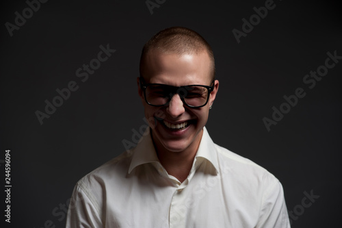 Positive young businessman in formal clothes