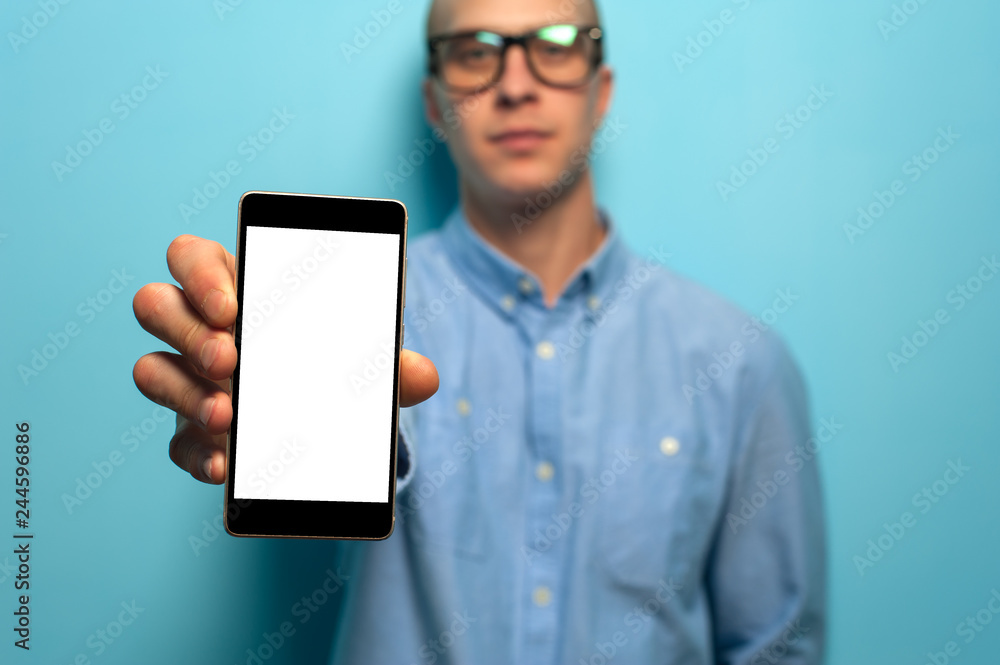 Hipster man holding smartphone