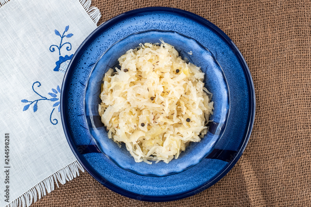 Sauerkraut in a blue bowl. Fresh healthy sauerkraut. Sauerkraut in a blue bowl. Fresh healthy sauerkraut.