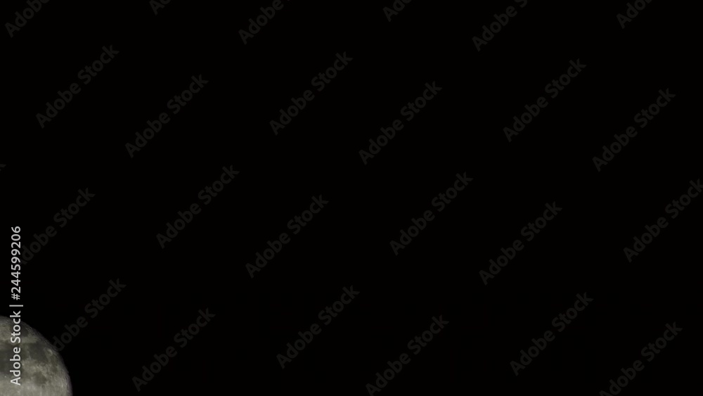 4K Moonrise enters and exits frame black night 4K Moonrise enters and exits frame black night