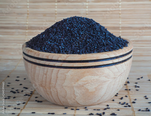 Black sesame in a wooden bowl.

