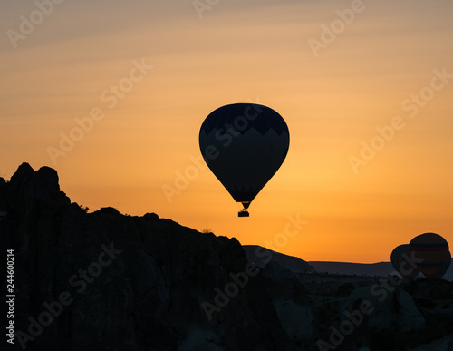 Hot air balloon silhouette at sunrise