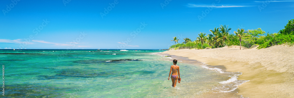 Hawaii beach woman relaxing swimming in bikini in idyllic ocean of lost paradise remote island tropical getaway. Wanderlust and adventure lifestyle banner panorama.