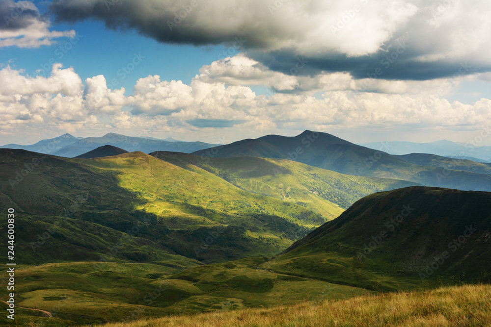 Summer landscapes of the Carpathian Mountains, with high mountain lakes and after thunderbolt rainbows.