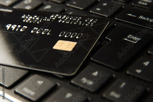 Credit card on a computer keyboard, close-up. Internet purchase