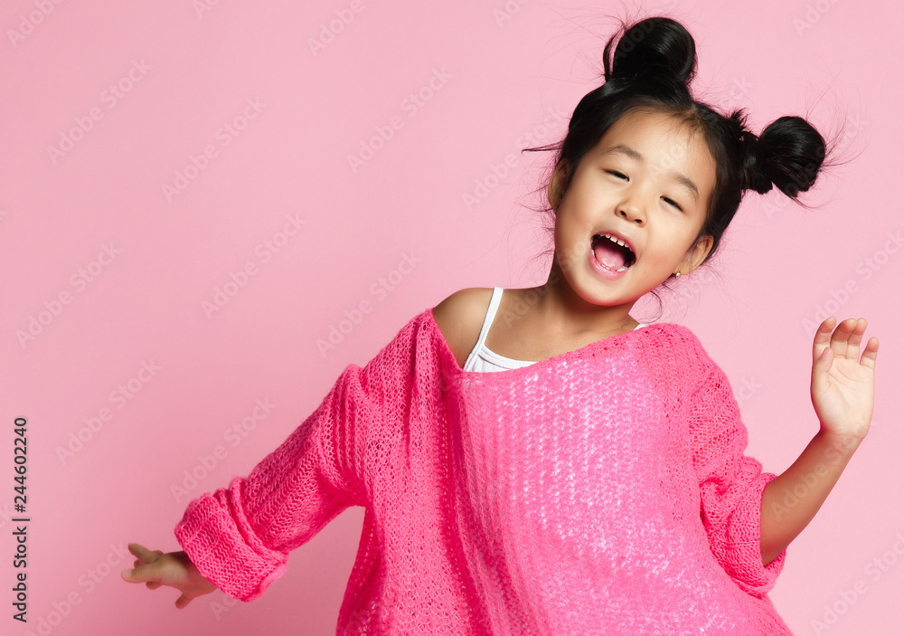 Asian kid girl in pink sweater, white 