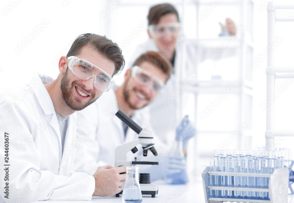 male biologist on blurred background male biologist on blurred background