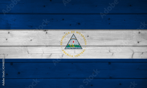 Flag of Nicaraqua on wooden background, surface. Wooden wall, planks. National flag