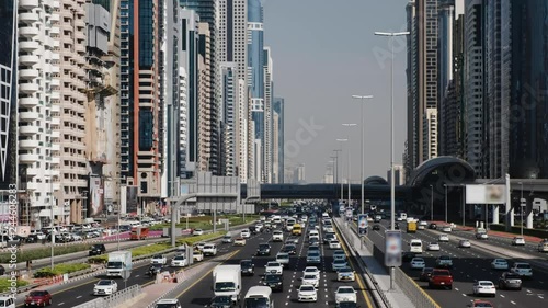 Cars run along widest Sheikh Zayed highway. High angle perspective, top view on driveway. Vehicle move on all lanes of the road. Real time shot