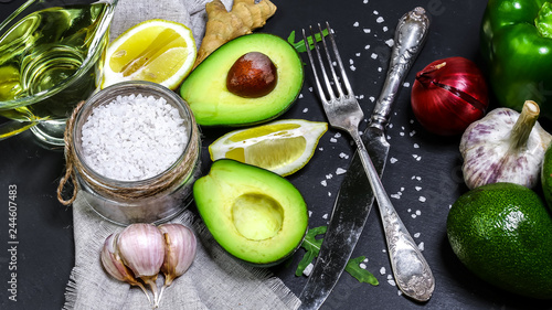 Healthy vegan food: fruit, vegetable, superfood, cereals, leaf vegetable on gray concrete background copy space