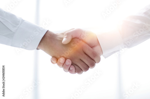 close up.handshake of business people on a light background
