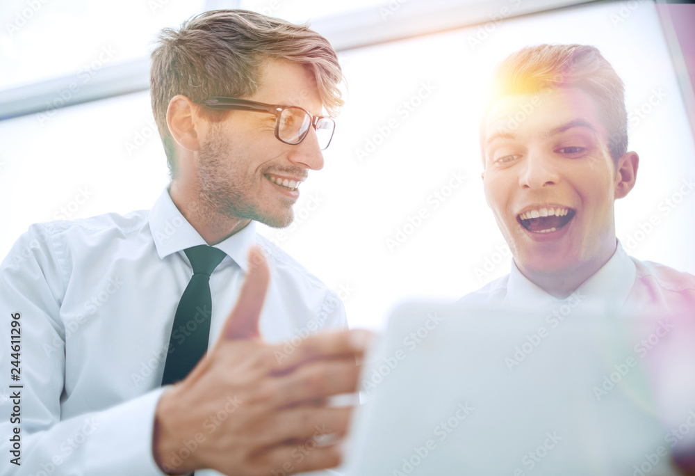 close up.young employees use a digital tablet close up.young employees use a digital tablet