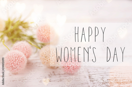 Flowers composition for Women's Day. Pink flowers on old white wooden background. photo