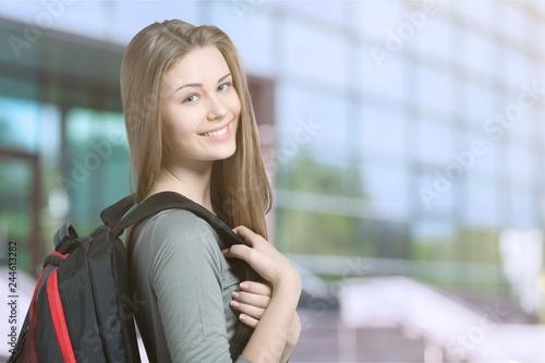 Pretty Young female student on background