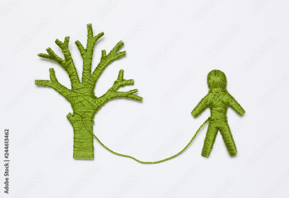 Fototapeta premium green yarn tree and human figure, isolated on white background. Ecology concept