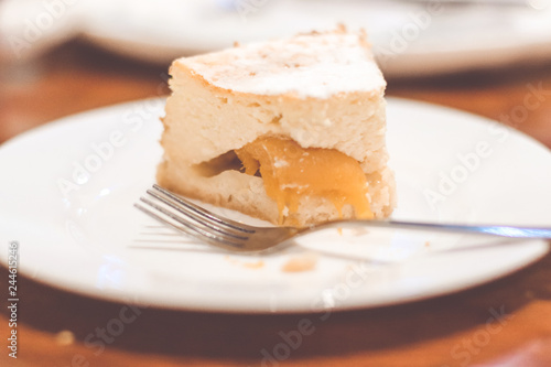 Slice of plain cheesecake. Peach cheesecake. 