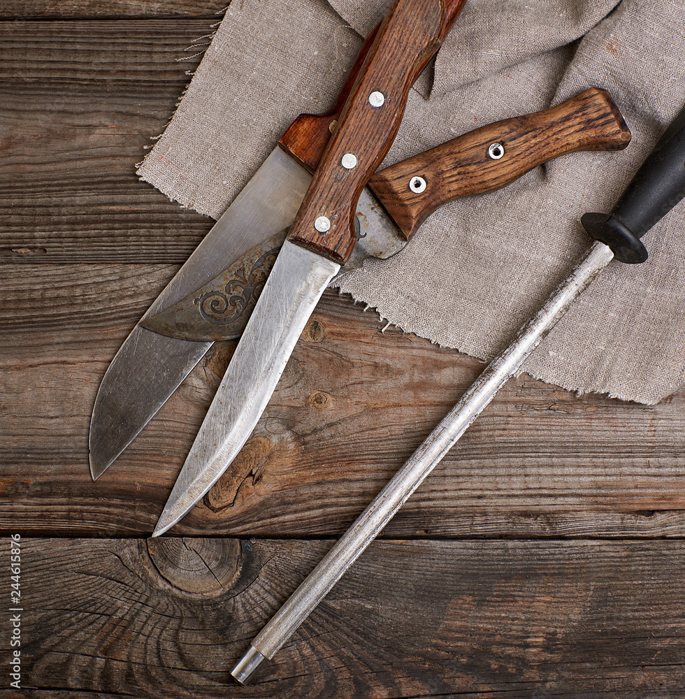 knife with sharpening on the wooden table knife with sharpening on the wooden table