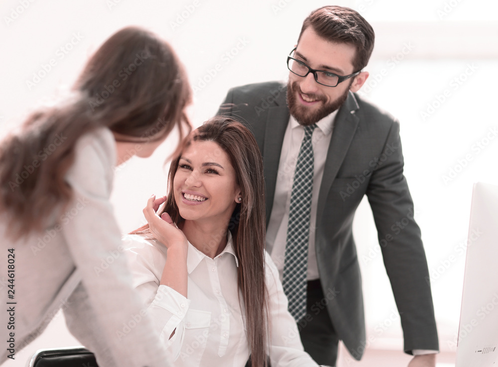 smiling business colleagues in the workplace smiling business colleagues in the workplace