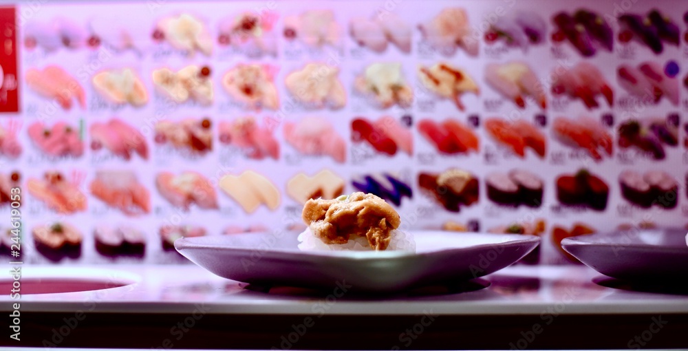 Conveyor belt sushi in Shinjuku District of Tokyo, Japan Stock Photo