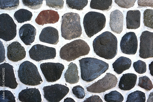 Fotografie Detail of brown stones on cement in Oia, Santorini