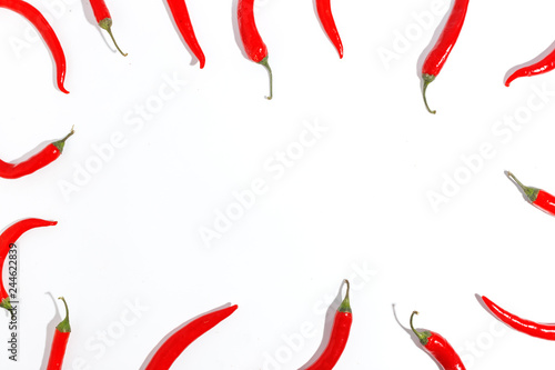 Red hot chili peppers on white background.