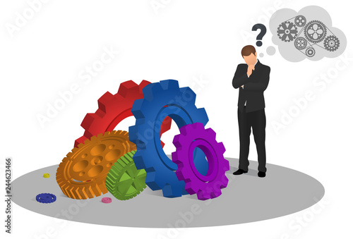 Pensive businessman looking at floor with colorful gear mechanisms and trying to figure out how to make it work. Man looking at cogwheels. Mechanism, success, idea, innovation, study concept.