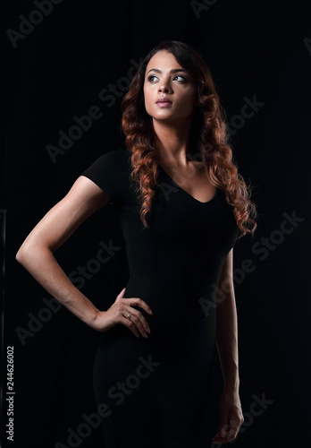 young gorgeous caucasian brunette in dress on chair