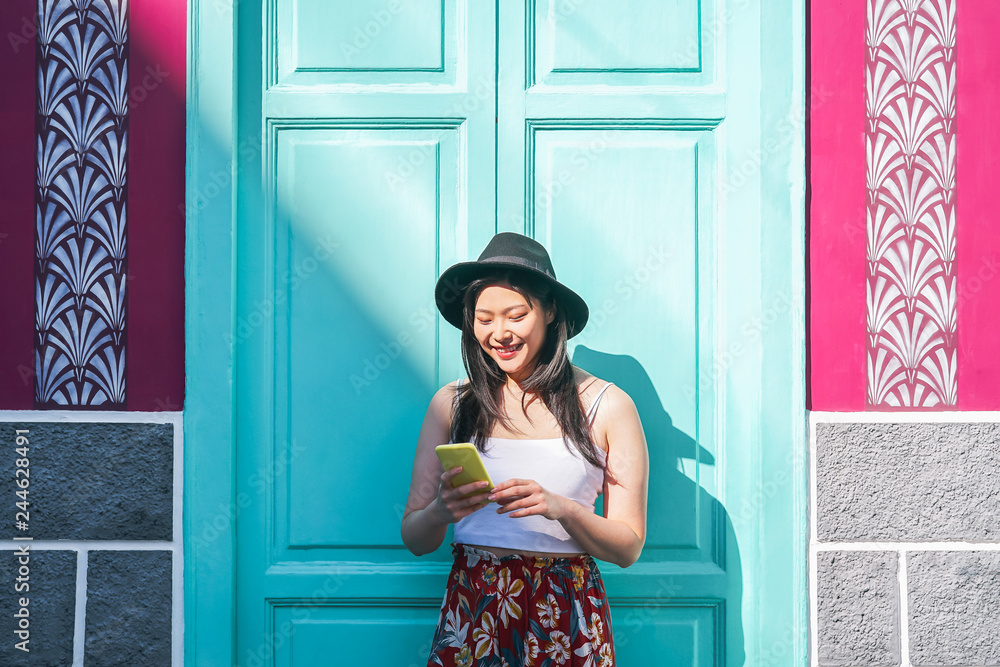 Foto Stock Happy asian woman using mobile smart phone outdoor Chinese