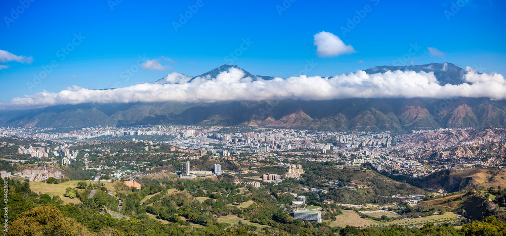 Panoramic view of Caracas in a sunny and beautiful day. you can see the Avila Mountain and the city at its foot as well as the surrounding hills