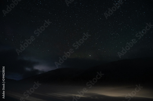 Night sky with many stars over the witer mountains © MagicalKrew
