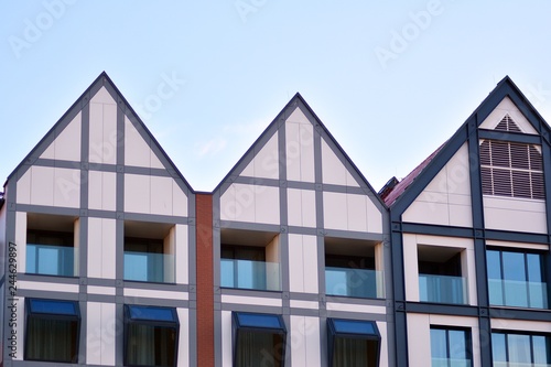 Modern apartment buildings on a sunny day with a blue sky. Facade of a modern apartment building