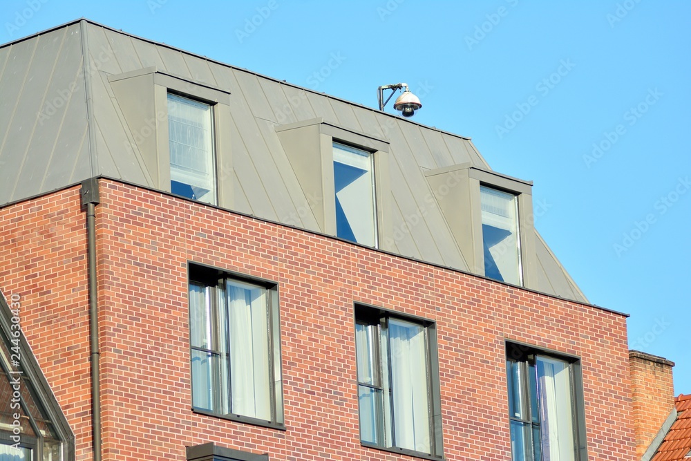 Modern apartment buildings on a sunny day with a blue sky. Facade of a modern apartment building