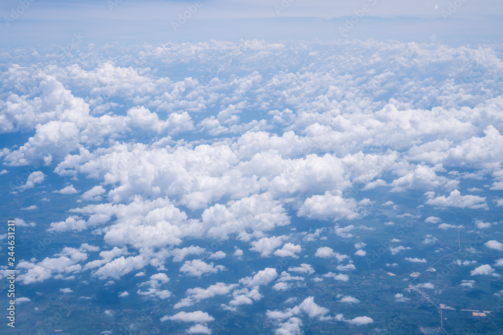 Sky scape cloudscape from aerial airplane shot of blue clouds. View flying above moutain from windows over Loei, Thailand. Sky scape cloudscape from aerial airplane shot of blue clouds. View flying above moutain from windows over Loei, Thailand.