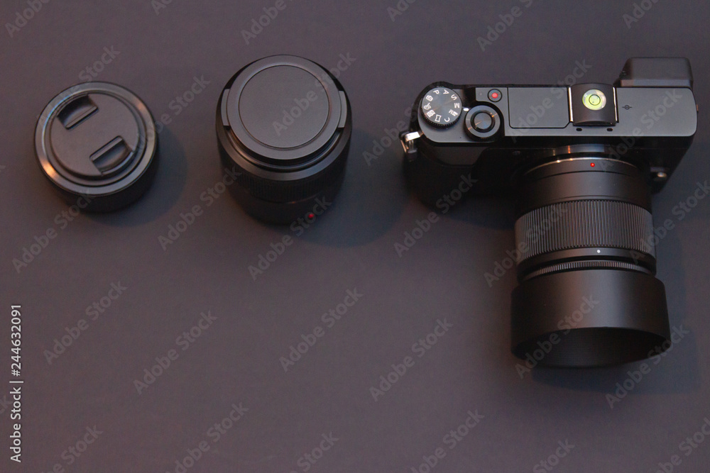 mirrorless interchangeablelens system photo camera with two lenses on