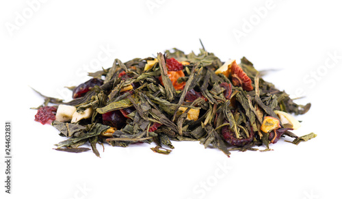 Green Ceylon tea with berries and fruits - apple, dog-rose, strawberry and cranberry, isolated on white background.