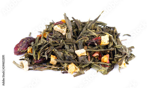 Green Ceylon tea with berries and fruits - apple, dog-rose, strawberry and cranberry, isolated on white background.
