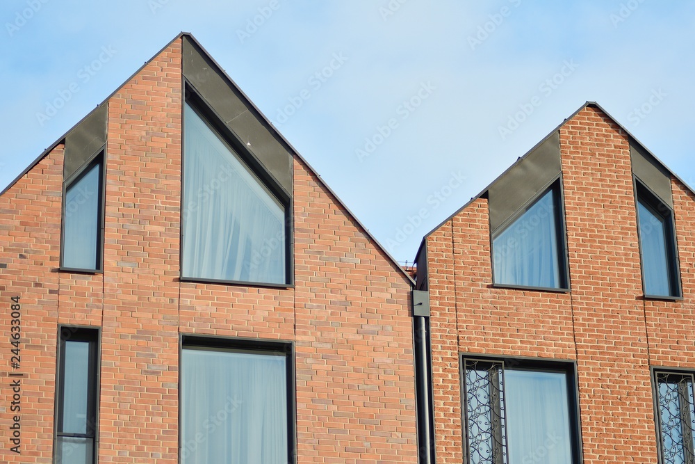 Modern apartment buildings on a sunny day with a blue sky. Facade of a modern apartment building Modern apartment buildings on a sunny day with a blue sky. Facade of a modern apartment building